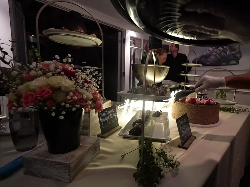 Attended buffet line set with chafing dishes for a catered event in Palo Alto