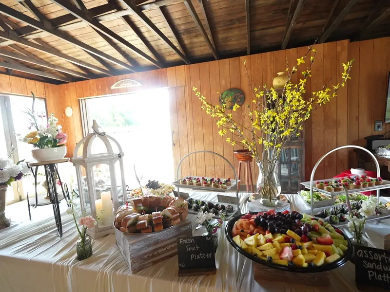 Server passing trays of appetizers to guests at a Saratoga reception