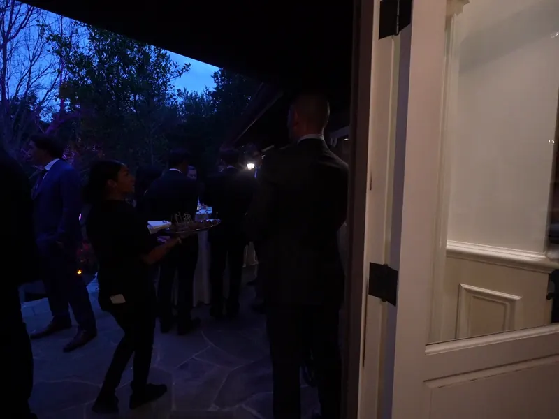 Server passing trays of appetizers to guests at a Palo Alto reception