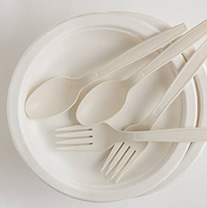 White plate with spoons and forks