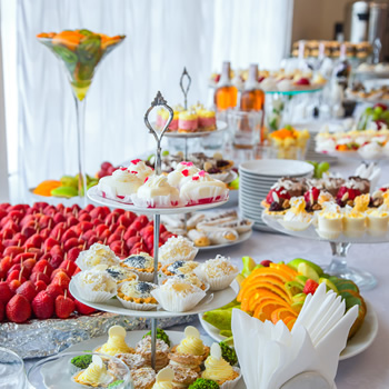 Desserts and beverages are catered at a lunch