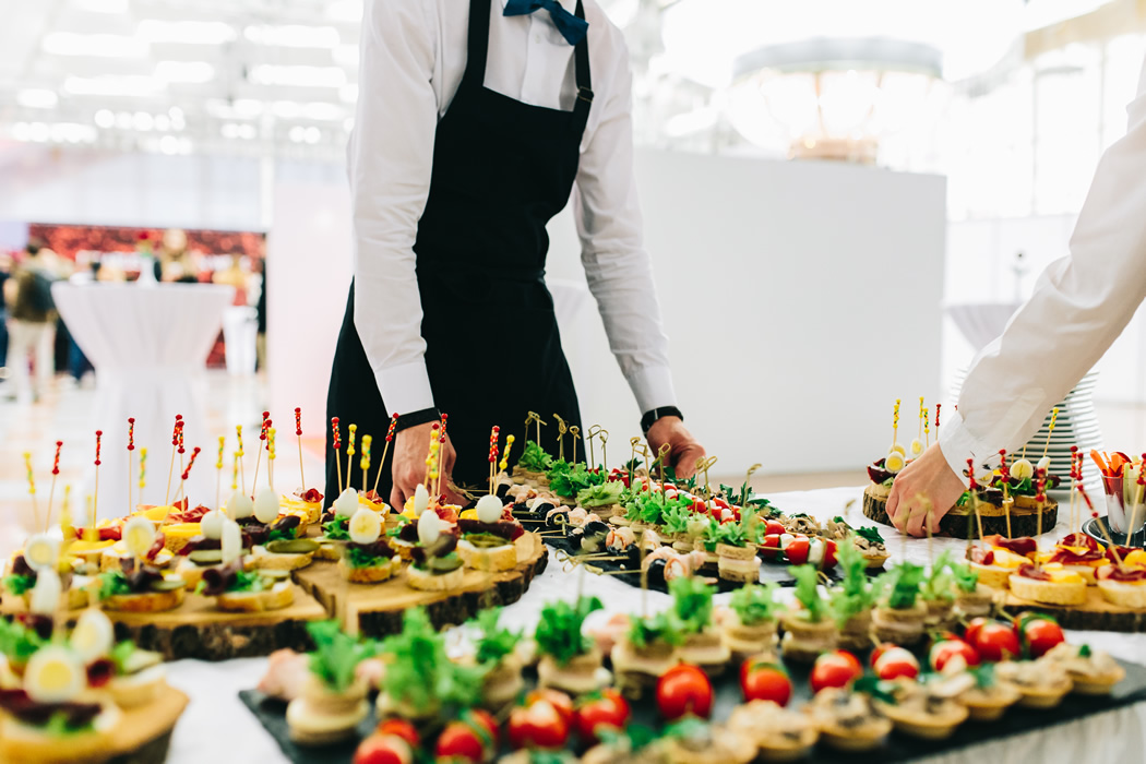Waiters are serving delicious appetizers at a dinner party